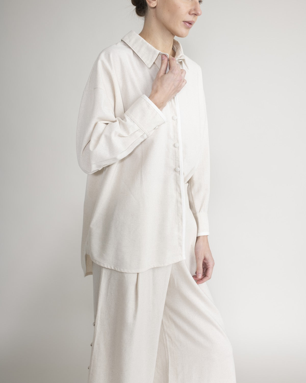 Shirt with covered buttons