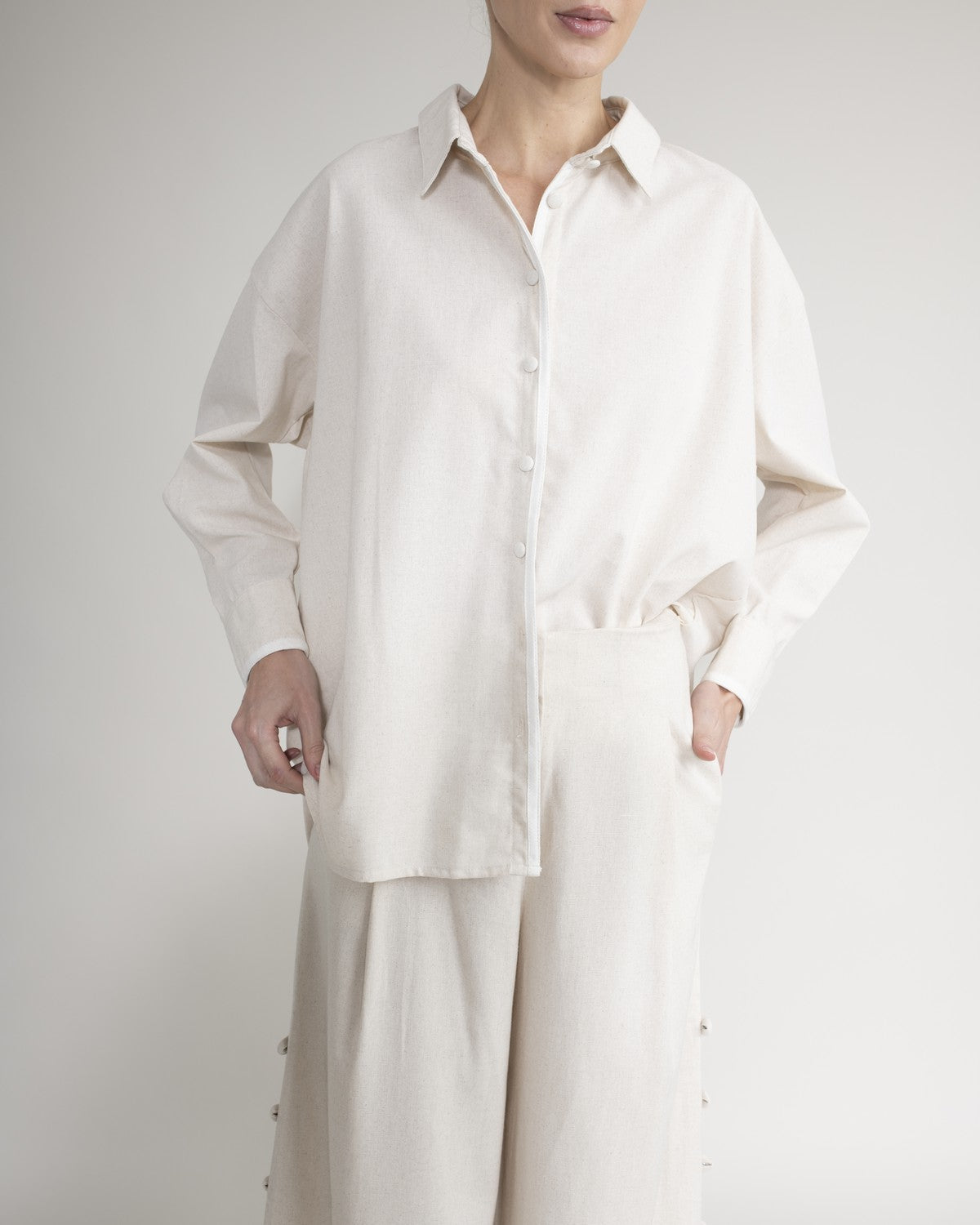 Shirt with covered buttons