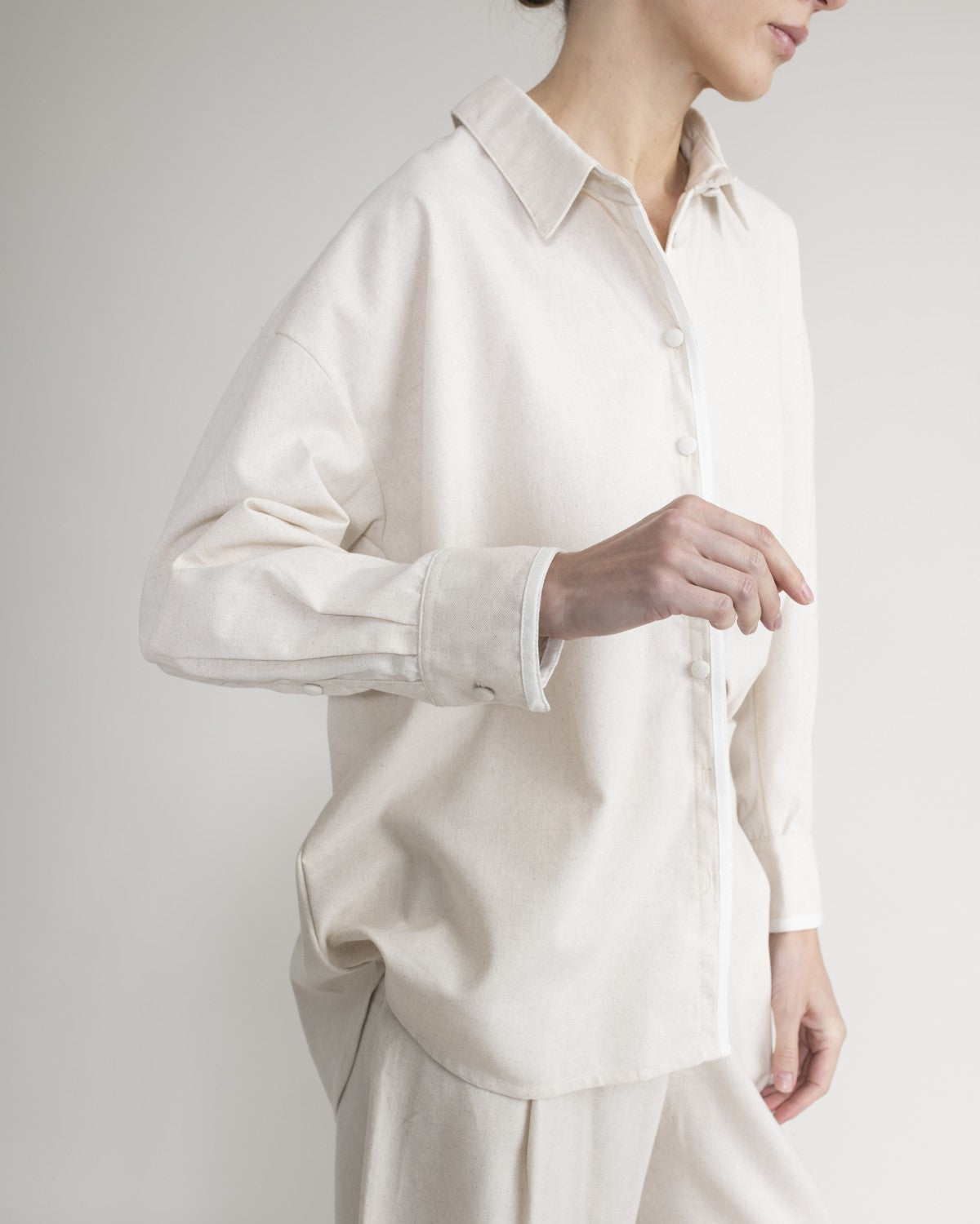 Shirt with covered buttons